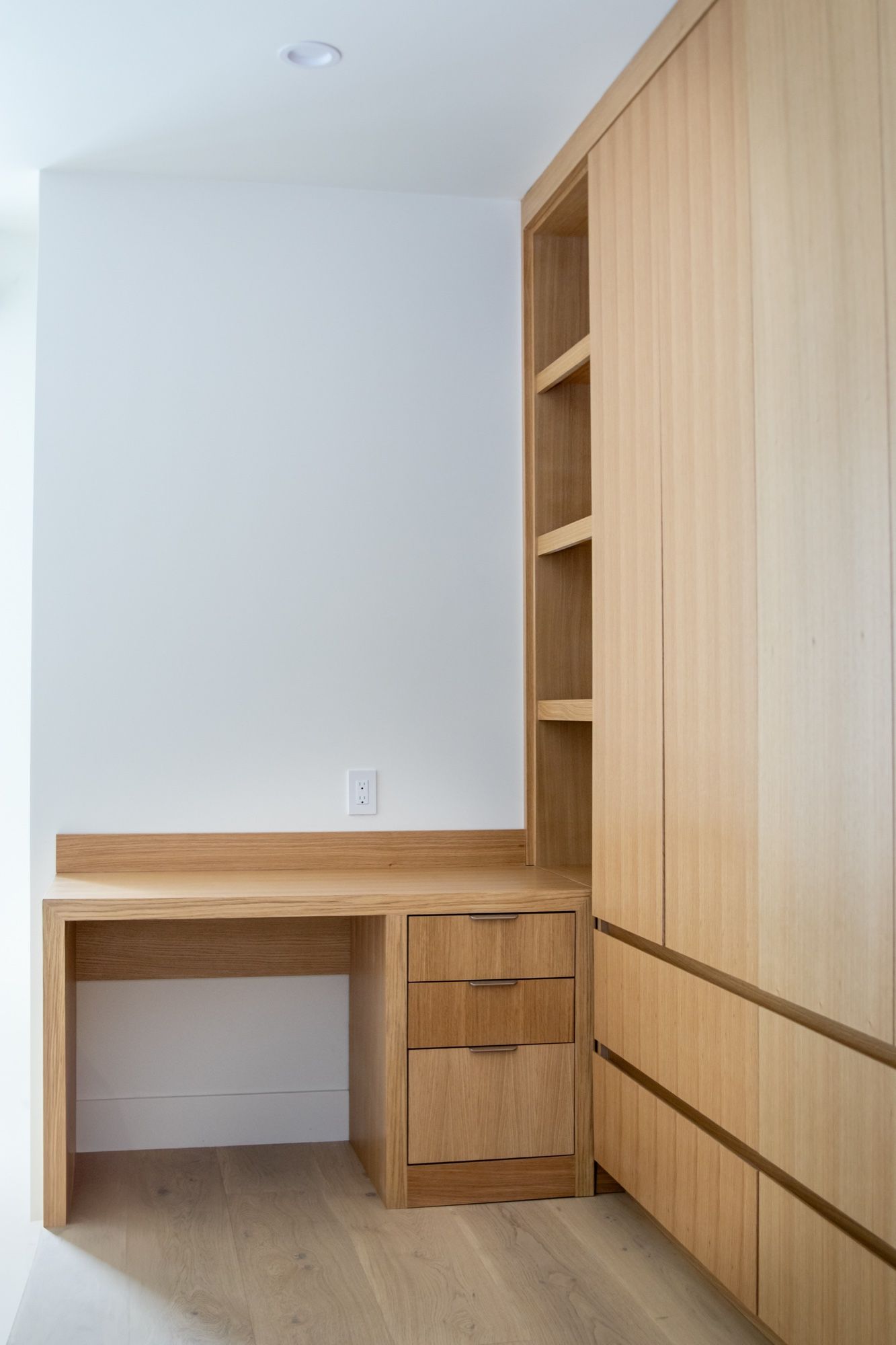 White oak built-in desk with tall storage tower